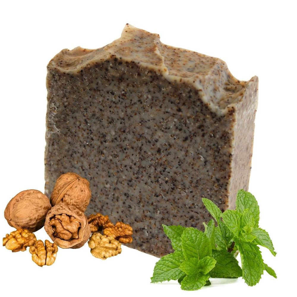 Walnut Peppermint Scrub bar with walnuts and peppermint leaves.