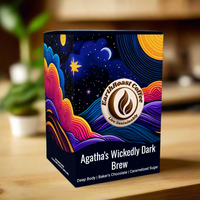 EarthRoast Coffee's Agatha's Wickedly Dark Brew coffee pods box featuring a vibrant, colorful night sky design with stars and swirls, highlighting this specialty coffee. Organic and sustainably sourced, this dark roast offers a rich body with notes of baker’s chocolate and caramelized sugar.