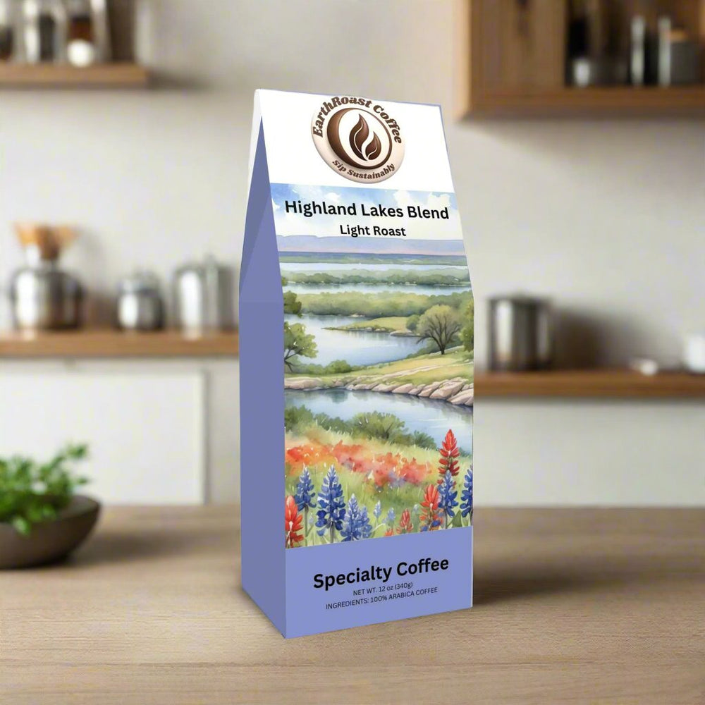 Front view of EarthRoast Coffee's Highland Lakes Specialty Coffee Blend, a light roast specialty coffee. Features a serene illustration of a Texas lakeside landscape with wildflowers, emphasizing its organic, sustainably sourced quality and fresh, bright flavors.